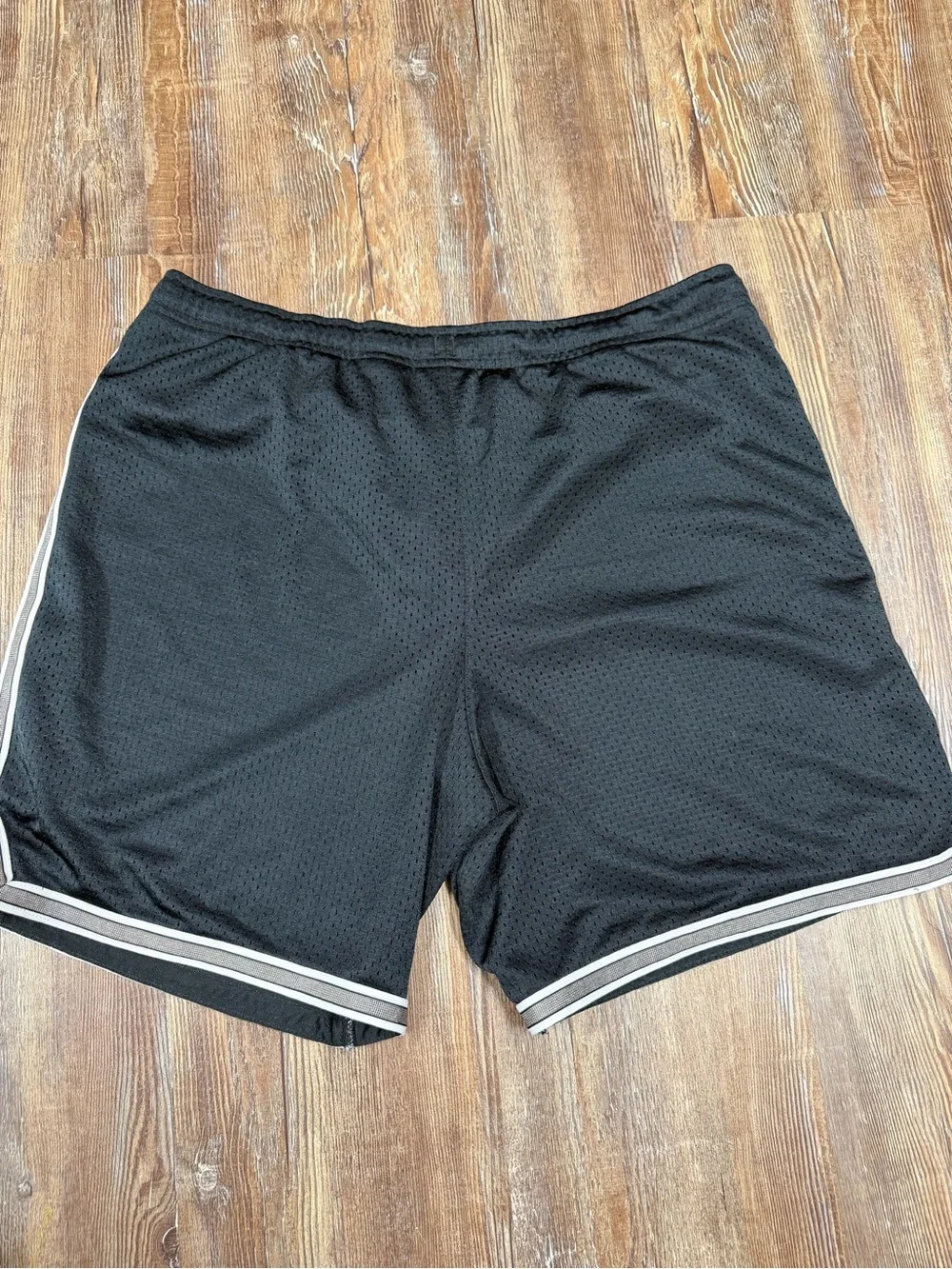 Vintage y2k Nike black shorts with white stripes on sides and hem, size S
